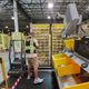 Amazon worker picking products from shelves